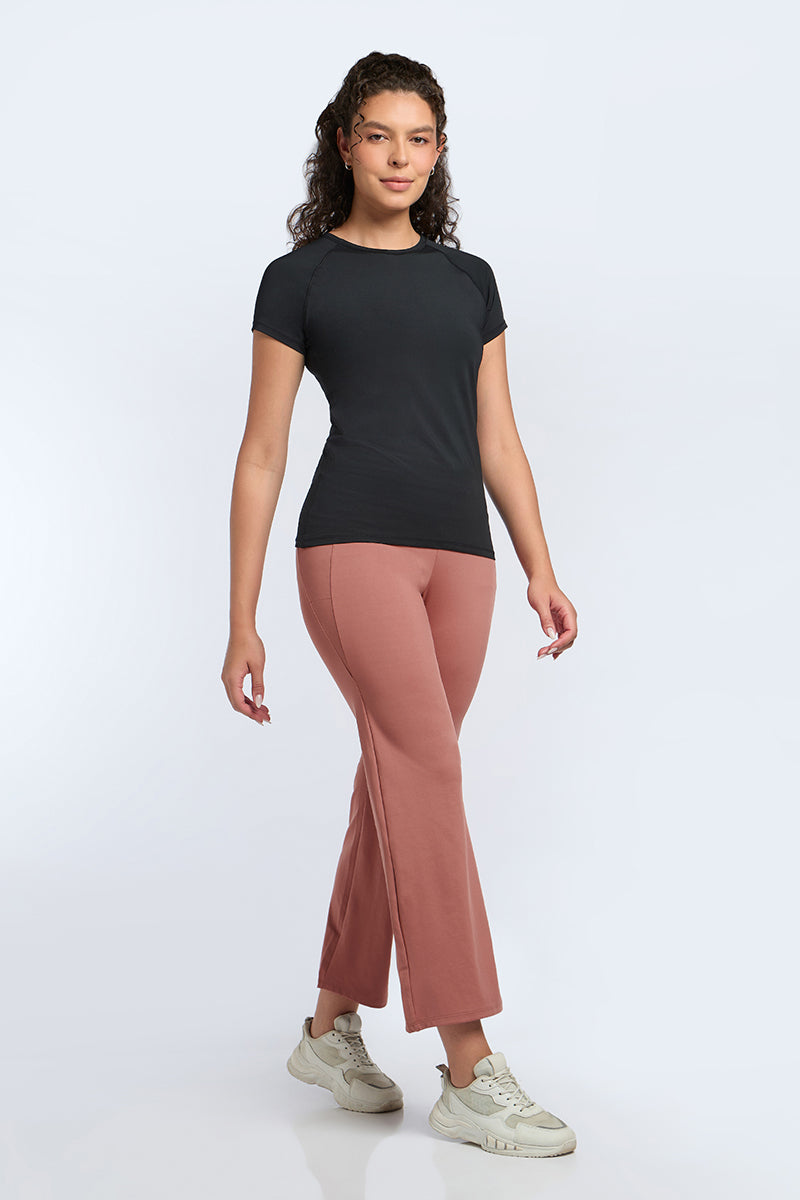 FLAUNT FLARED TRAVEL PANTS - Brick Dust