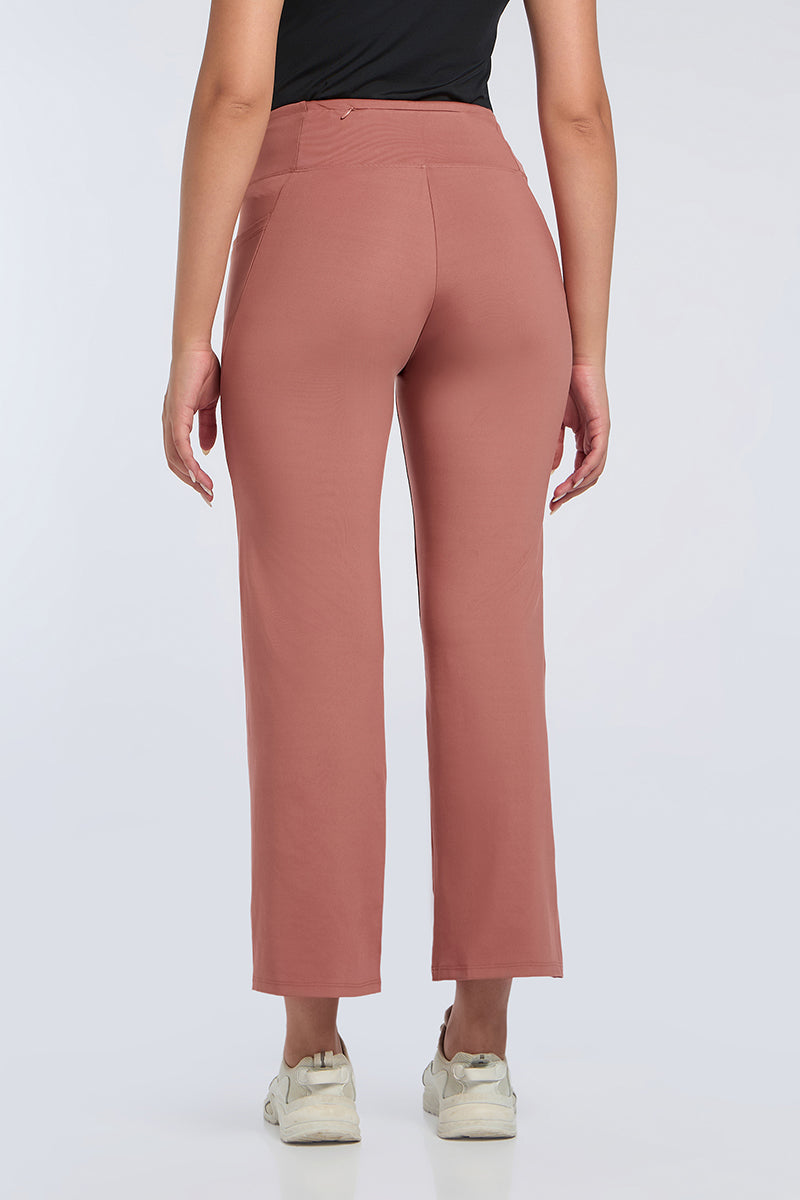 FLAUNT FLARED TRAVEL PANTS - Brick Dust